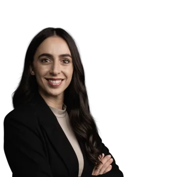 The best references for our hotel marketing Portrait of a smiling woman with dark hair wearing a black blazer