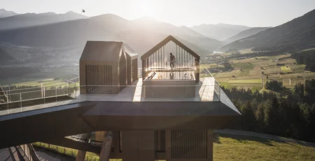 The best references for our hotel marketing Modern platform with pool overlooking mountains and valley at sunset
