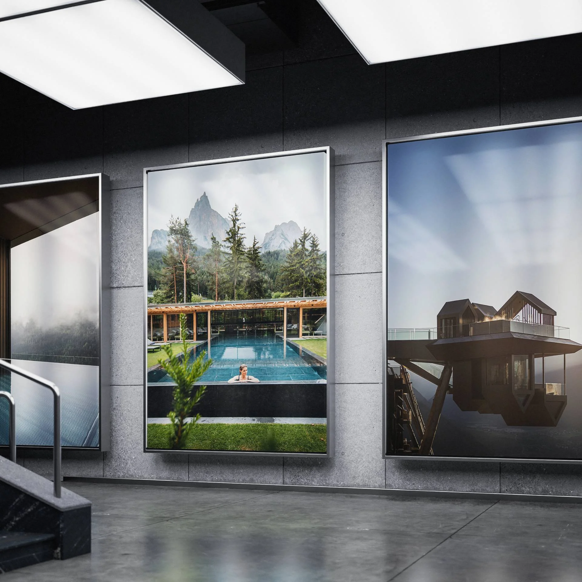 The best references for our hotel marketing Three large nature and architecture posters displayed in a modern gallery space