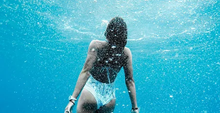 The best references for our hotel marketing Person swimming underwater in clear blue water