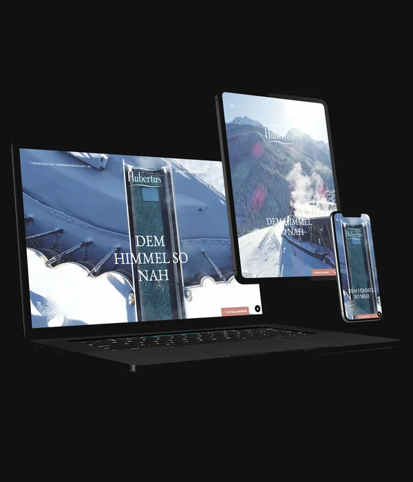 Eine Website mit Stil – made by Brandnamic Laptop, Tablet und Smartphone zeigen dieselbe Winter-Webseite mit dem Text DEM HIMMEL SO NAH